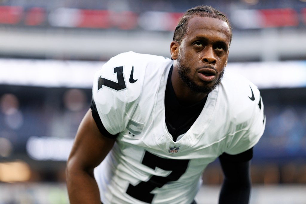 Geno Smith #7 of the Las Vegas Raiders stretches on the field prior to an NFL 