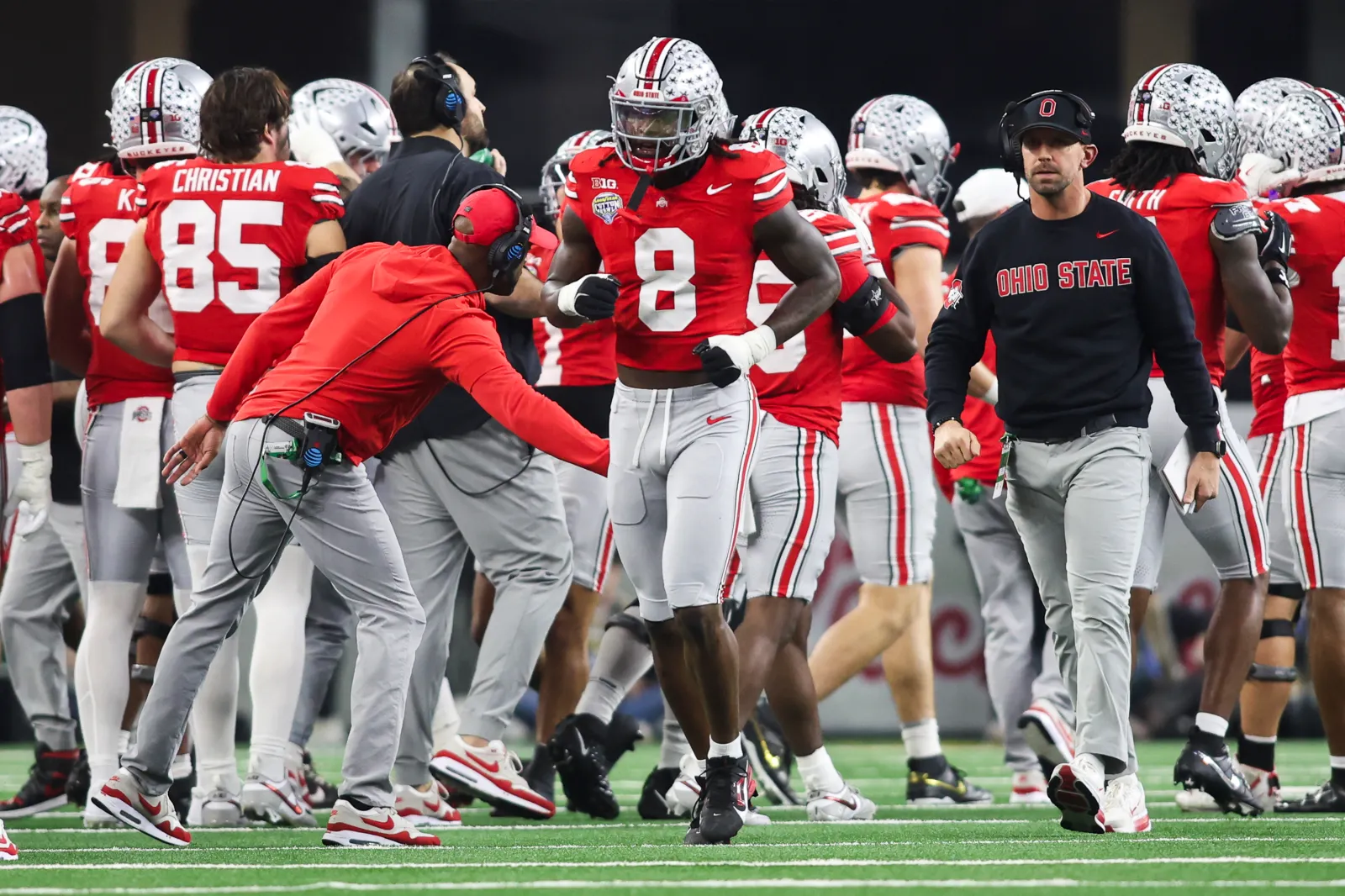 Arvell Reese #8 of the Ohio State Buckeyes reacts after a defensive play in the first half during the College Football Playoff Quarter Final Game against the Miami Hurricanes at AT&T Stadium on December 31, 2025 in Arlington, Texas.
