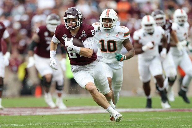 Nate Boerkircher #87 of the Texas A&M Aggies runs after a catch in the first half against the Miami Hurricanes during the 2025 College Football Playoff First Round Game at Kyle Field on December 20, 2025 in College Station, Texas. (Photo by Tim Warner/Getty Images)