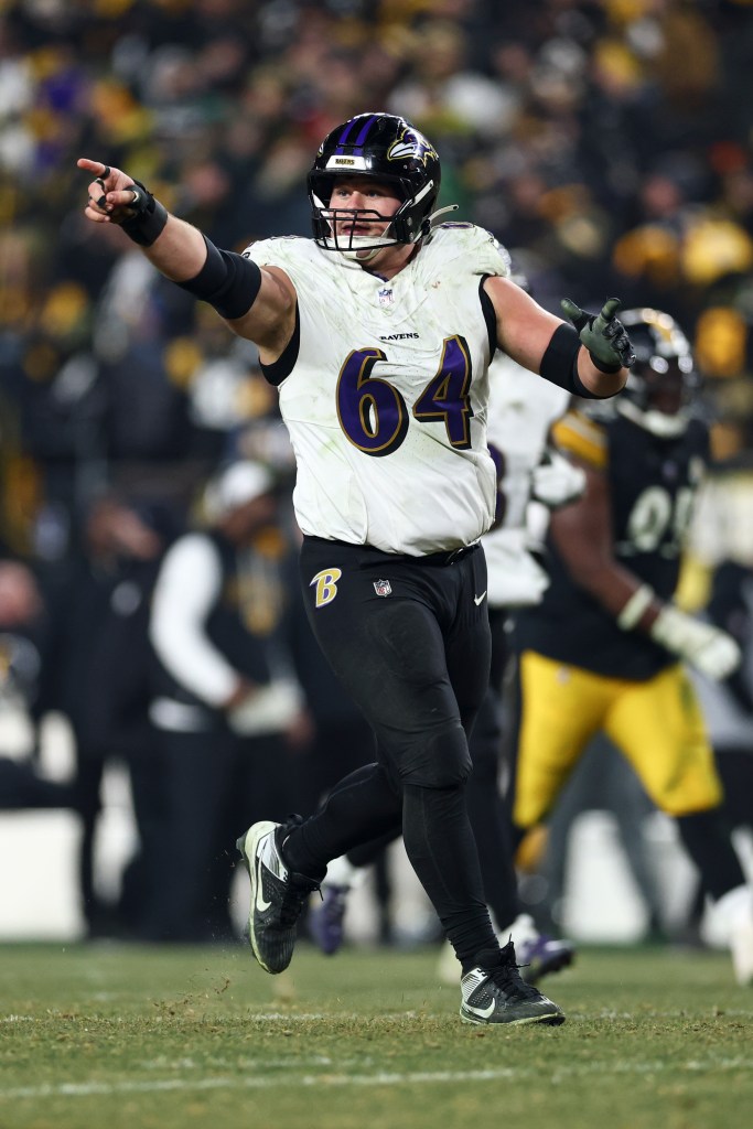 Tyler Linderbaum of the Baltimore Ravens celebrates during an NFL football game.
