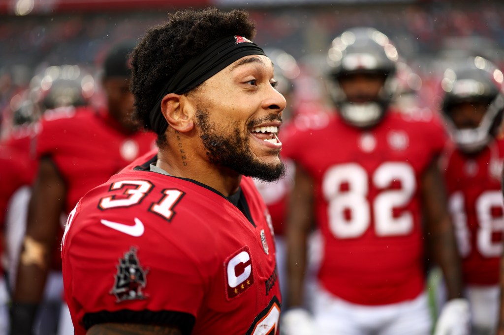 Antoine Winfield Jr. talks to teammates in a huddle prior to an NFL football game against the Carolina Panthers at Raymond James Stadium on January 3, 2026 in Tampa, Florida.