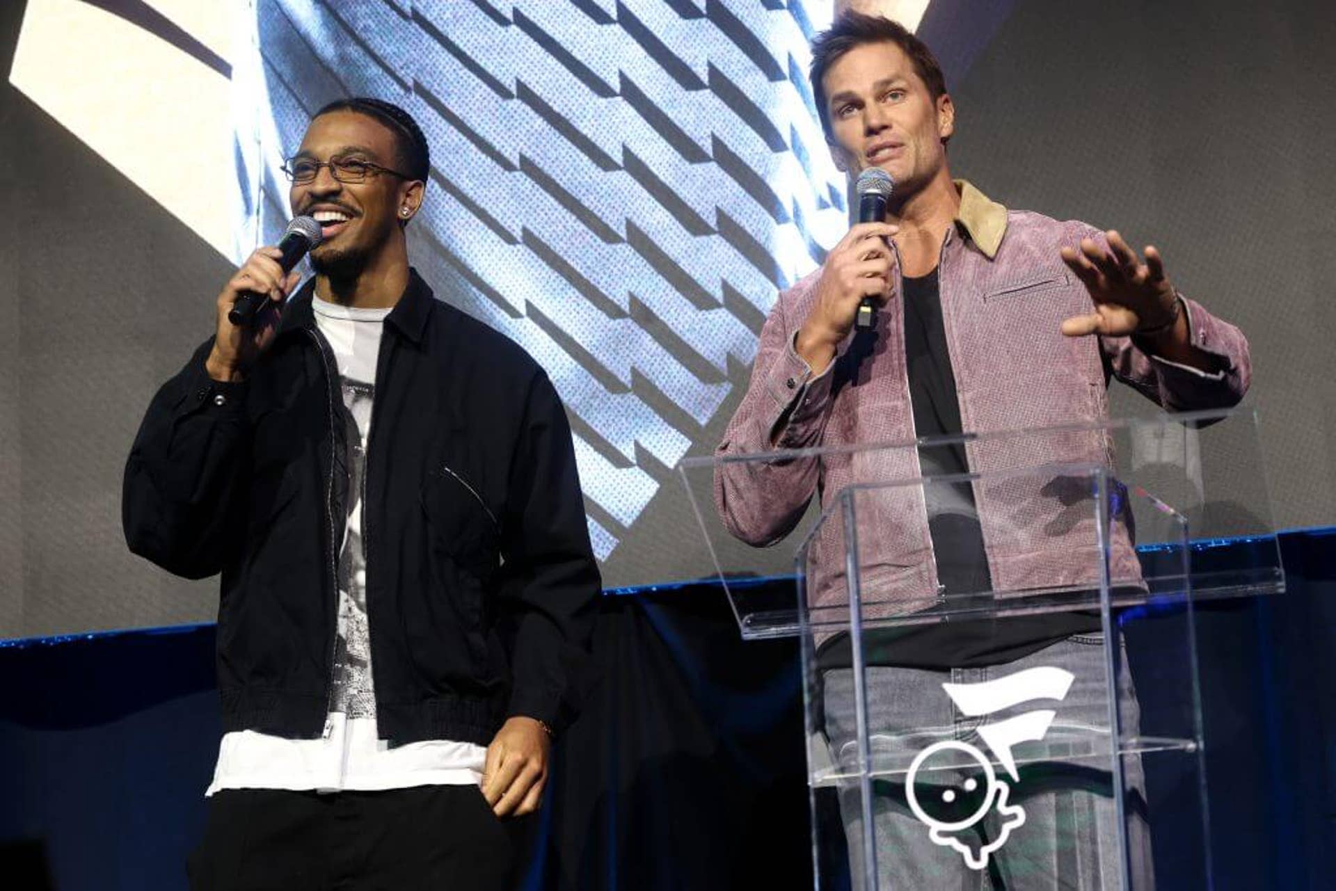 Jayden Daniels and Tom Brady speak at an event promoting the launch of Fanatics Studios.