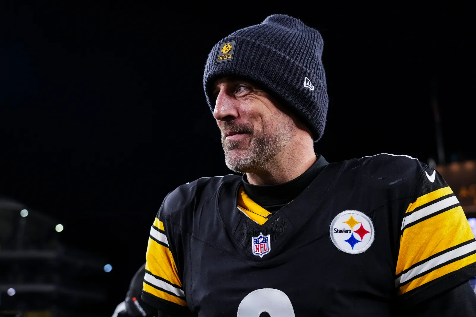 Aaron Rodgers #8 of the Pittsburgh Steelers looks on from the field after an NFL wild card playoff football game against the Houston Texans at Acrisure Stadium on January 12, 2026 in Pittsburgh, Pennsylvania.