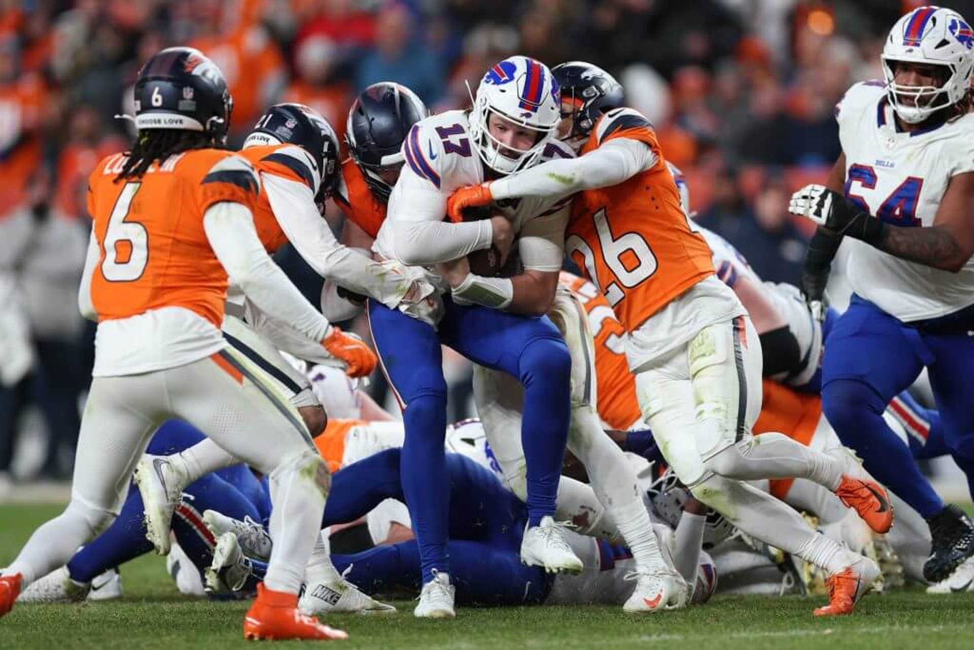 Josh Allen runs the ball for a first down against the Denver Broncos.
