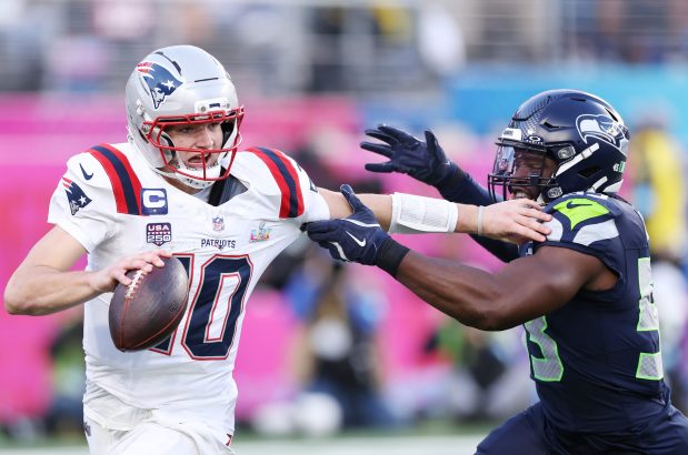 Patriots QB Drake Maye is pressured by Seattle Seahawks defender Boye Mafe during the second quarter in Super Bowl LX at Levi's Stadium on Feb. 08, 2026 in Santa Clara, Calif. (Photo by Kevin C. Cox/Getty Images)