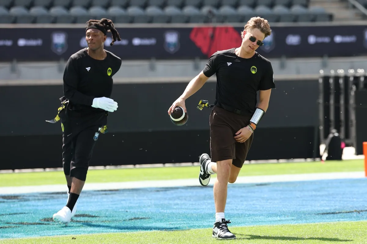 DeAndre Hopkins and Joe Burrow on the field together for Flag Football Classic