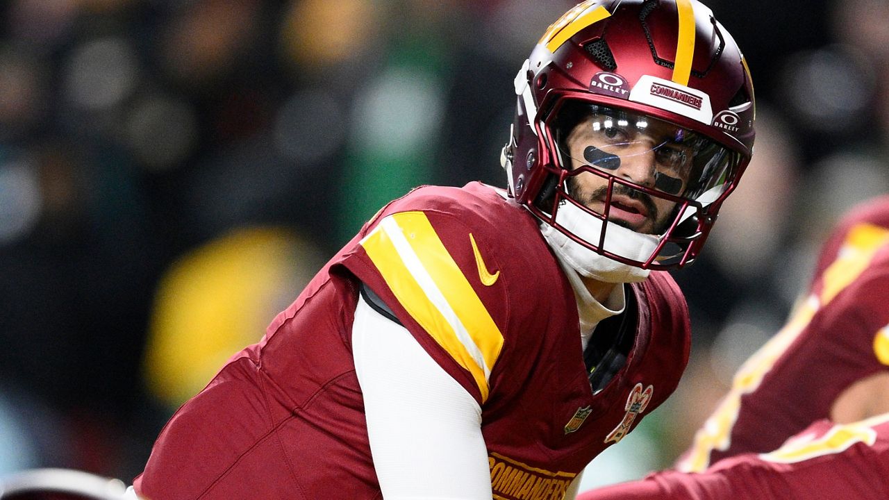 Washington Commanders quarterback Marcus Mariota prepared to take a snap under center against the Philadelphia Eagles on Dec. 20, 2025, in Landover, Md.