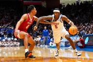 SMU guard Jaron Pierre Jr. (5) controls the ball against Miami (Ohio) forward Eian Elmer (0)...