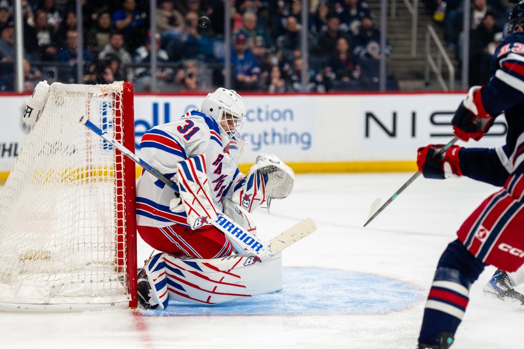 Igor Shesterkin makes a shoulder save during the Rangers' road win over the Jets.