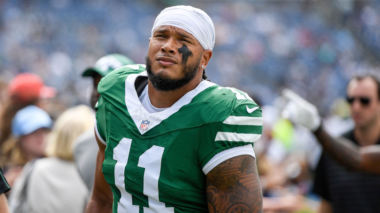 New York Jets linebacker Jermaine Johnson (11) takes the field against the Tennessee Titans during the first half at Nissan Stadium.