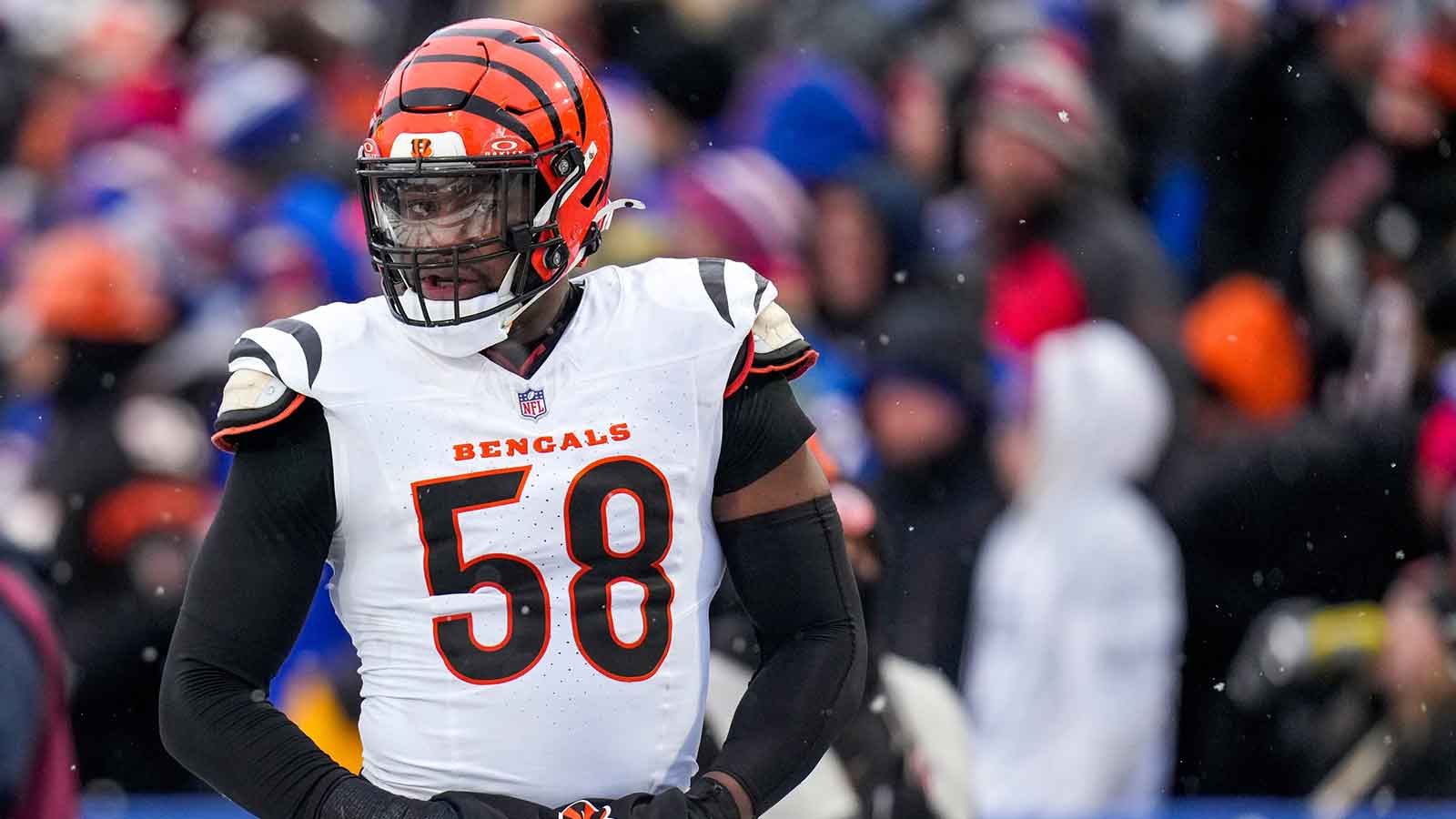 Cincinnati Bengals defensive end Joseph Ossai (58) walks for the locker room with trainers in the fourth quarter of the NFL Week 14 game between the Buffalo Bills and the Cincinnati Bengals