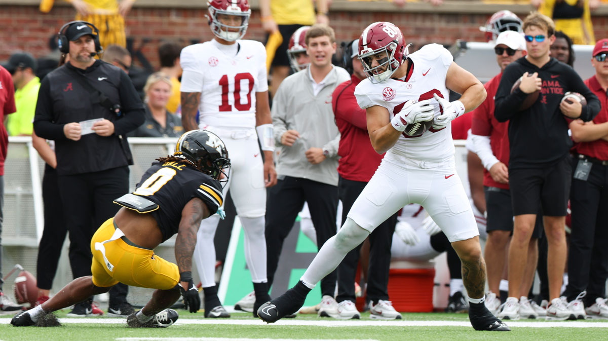 Alabama Crimson Tide tight end Josh Cuevas (80) avoids a tackle against Missouri Tigers cornerback Stephen Hall (0) during the first quarter of the game at Faurot Field at Memorial Stadium. Mandatory Credit: Reese Strickland-Imagn Images