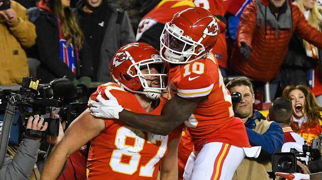 Kansas City Chiefs wide receiver Tyreek Hill celebrates tight end Travis KelceÕs game-winning touchdown in overtime of the AFC Divisional Playoff game between the Chiefs and the Buffalo Bills at GEHA Field at Arrowhead Stadium on Dec. 23, 2022. The Chiefs beat the Bills 42-36.