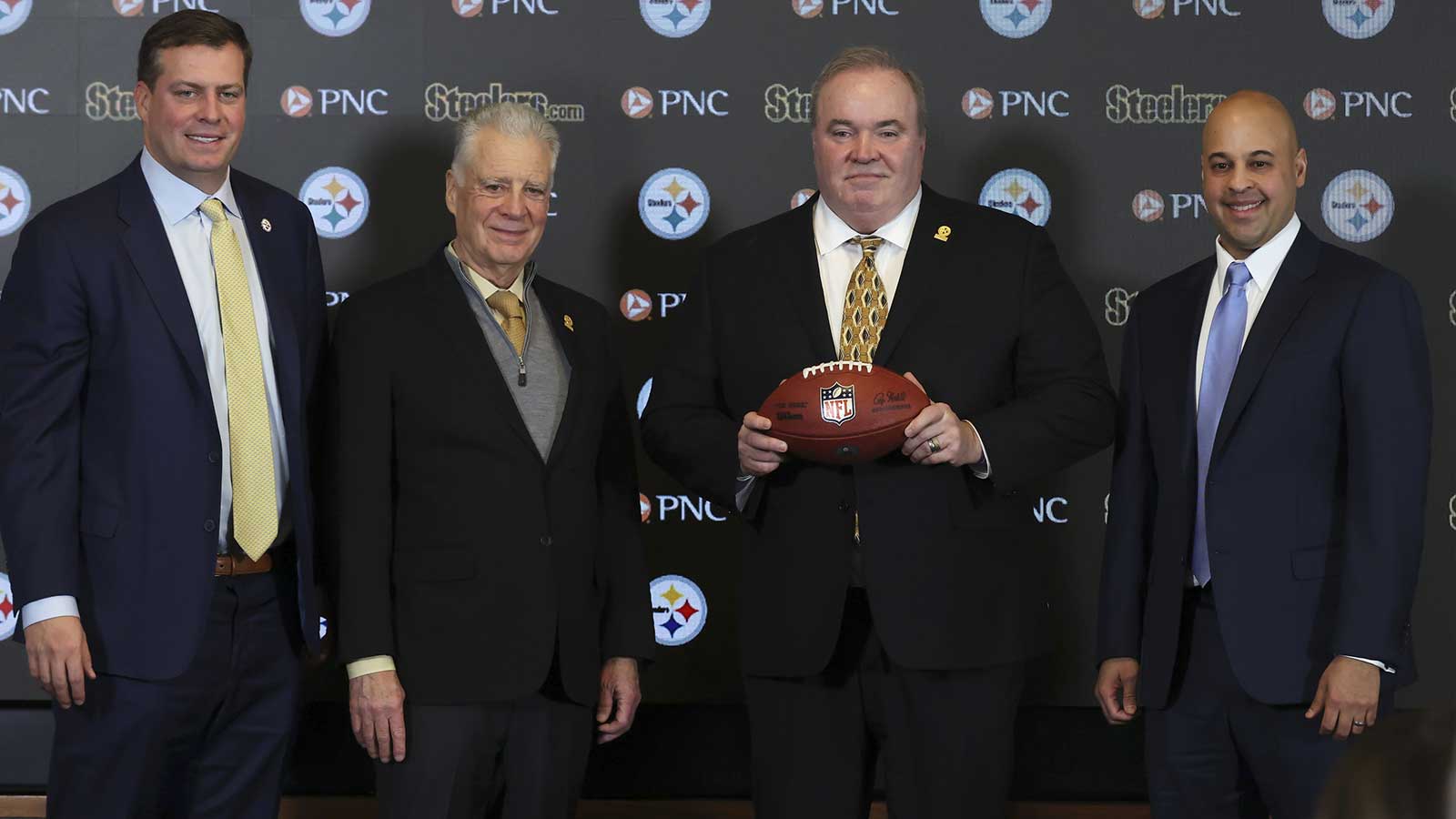 Daniel Martin Rooney (left), Pittsburgh Steelers owner Art Rooney II (left center) and general manager Omar Khan (right) flank Mike McCarthy (middle) at a press conference announcing McCarthy as the new Pittsburgh Steelers head coach at PNC Champions Club at Acrisure Stadium.
