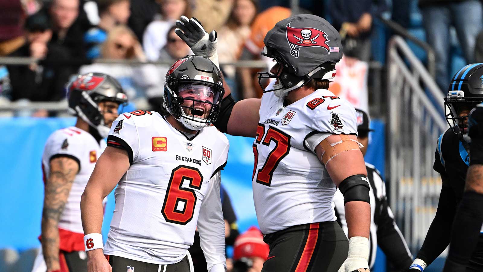 Tampa Bay Buccaneers wide receiver Mike Evans (13) celebrates with offensive tackle Luke Goedeke (67) after a touchdown during the first half against the Carolina Panthers at Bank of America Stadium.
