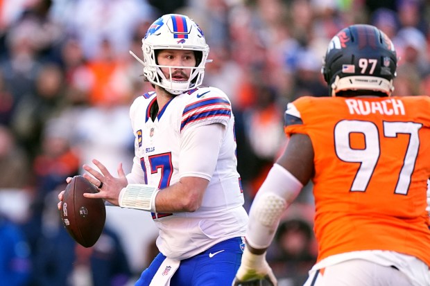 Buffalo Bills quarterback Josh Allen looks for a receiver during the first half of an NFL divisional round playoff game against the Denver Broncos, Jan. 17, 2026, in Pittsburgh. (AP Photo/David Zalubowski, File)
