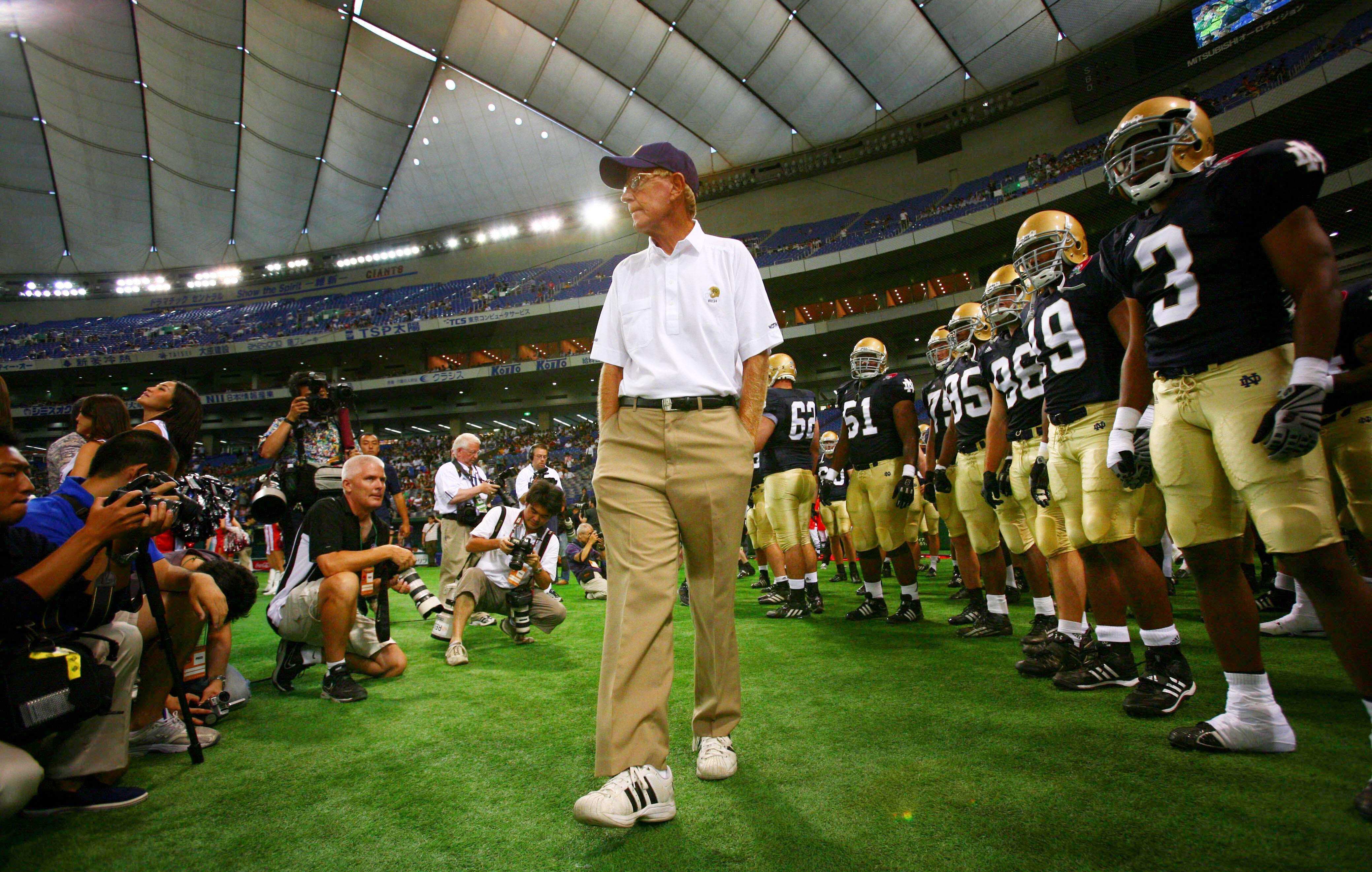 FILE – Notre Dame football coach Lou Holtz and his...