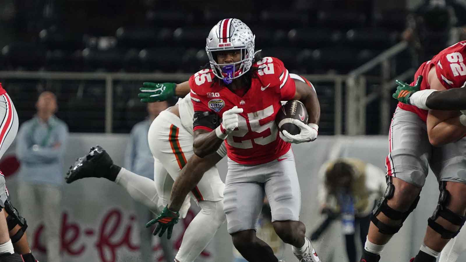 Ohio State Buckeyes running back Bo Jackson (25) carries the ball against the Miami Hurricanes during the second half of 2025 Cotton Bowl and quarterfinal game of the College Football Playoff at AT&T Stadium.