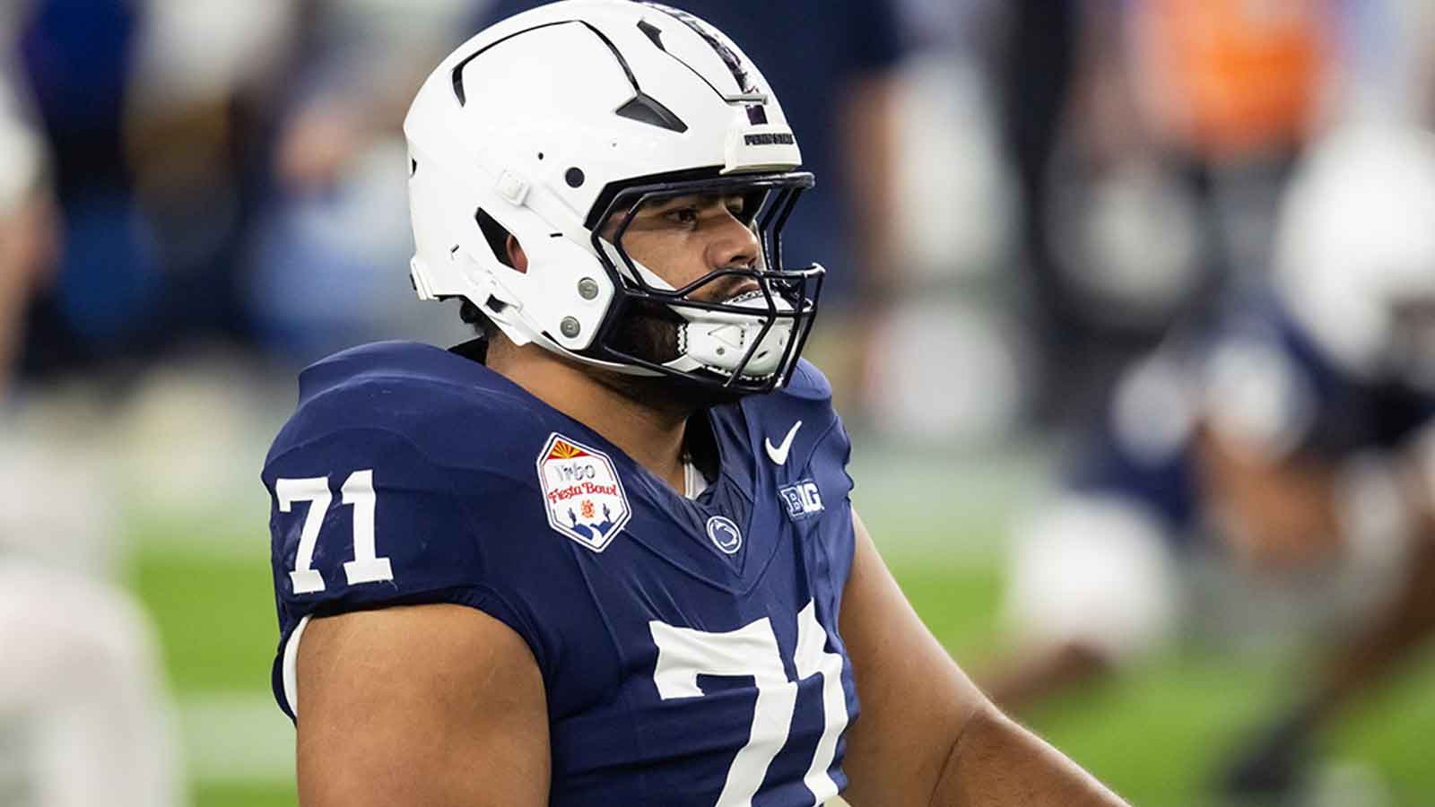 Penn State Nittany Lions offensive lineman Olaivavega Ioane (71) against the Boise State Broncos during the Fiesta Bowl at State Farm Stadium.