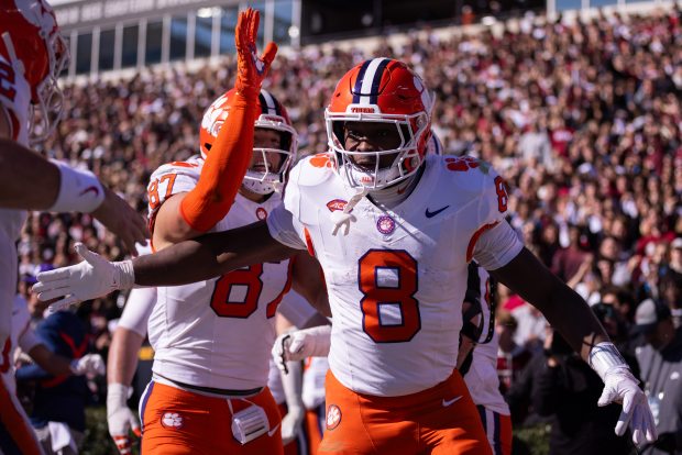 Clemson running back Adam Randall celebrates after a touchdown against South Carolina during the first half of an NCAA football game on Saturday, Nov. 29, 2025, in Columbia, S.C. (AP Photo/Scott Kinser)