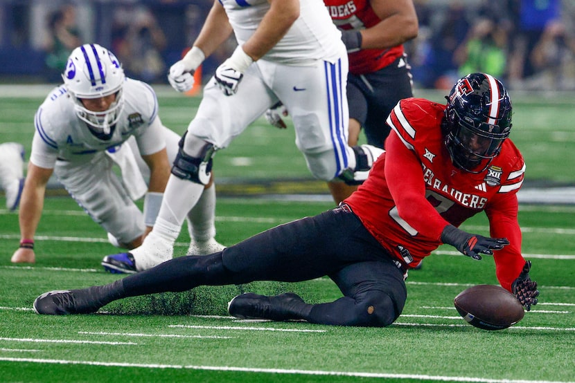 Texas Tech defensive end Romello Height (9) recovers a fumble during the second half of the...