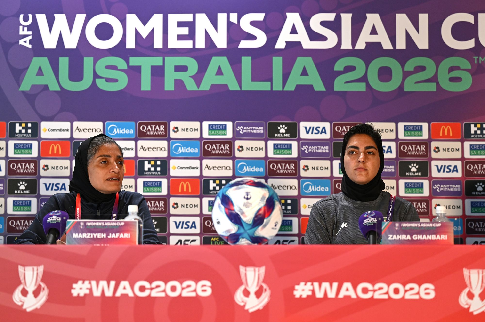 Iranian women’s national soccer team coach Marziyeh Jafari, left, and captain Zahra Ghanbari react during a press conference ahead of their game against South Korea at Robina Stadium on the Gold Coast, Australia, Sunday, 1 March 2026