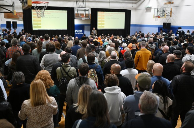 A large crowd gathers in a gymnasium for a community meeting hosted by the Denver Broncos at the La Alma Recreation Center to share preliminary concepts for the proposed new stadium and mixed-use community at Burnham Yard in Denver on Feb. 12, 2026. (Photo by RJ Sangosti/The Denver Post)