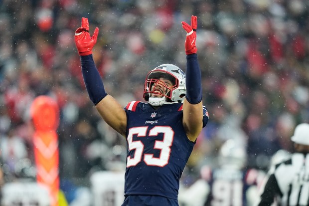 New England Patriots linebacker Christian Elliss (53) celebrates during the first half of an NFL divisional playoff football game against the Houston Texans, Sunday, Jan. 18, 2026, in Foxborough, Mass. (AP Photo/Robert F. Bukaty)