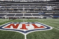 The NFL logo, painted at mid field as crews worked to prepare Cowboys Stadium in Arlington,...