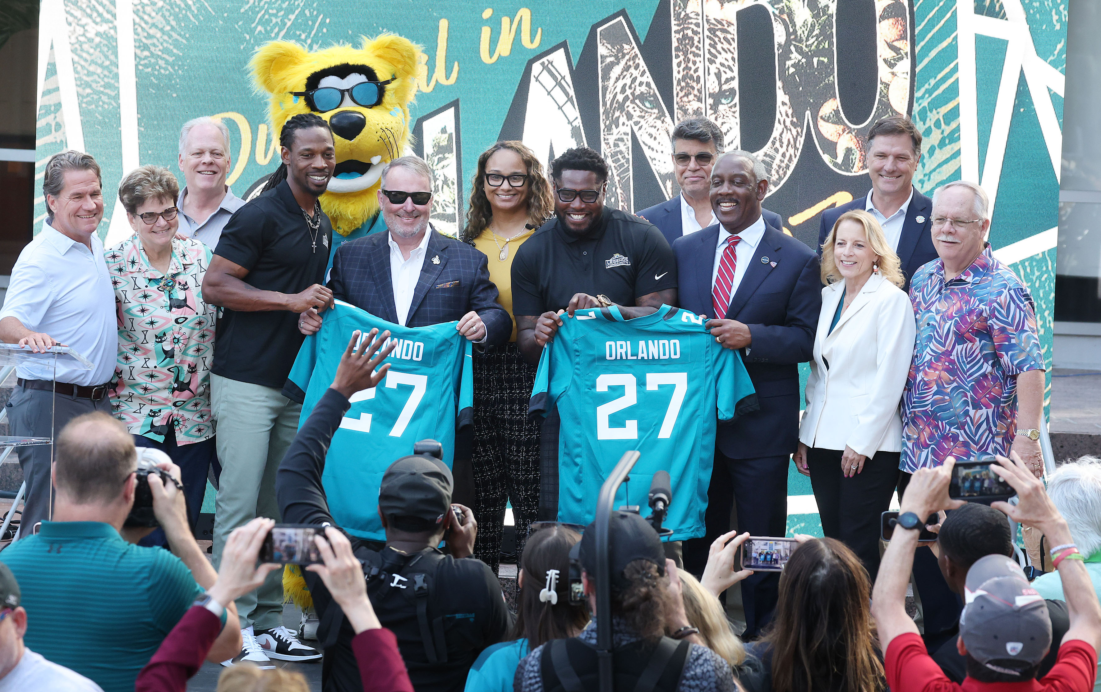 Orlando Mayor Buddy Dyer (holding jersey at left), Orange County...