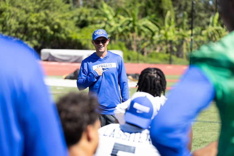 BYU offensive coordinator Aaron Roderick talks to players during a practice at BYU's  outdoor practice facility in Provo.