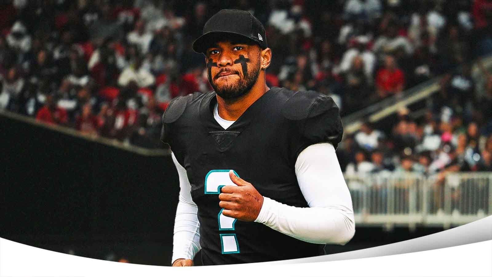 Tua Tagovailoa wearing a black jersey with a question mark instead of a number.