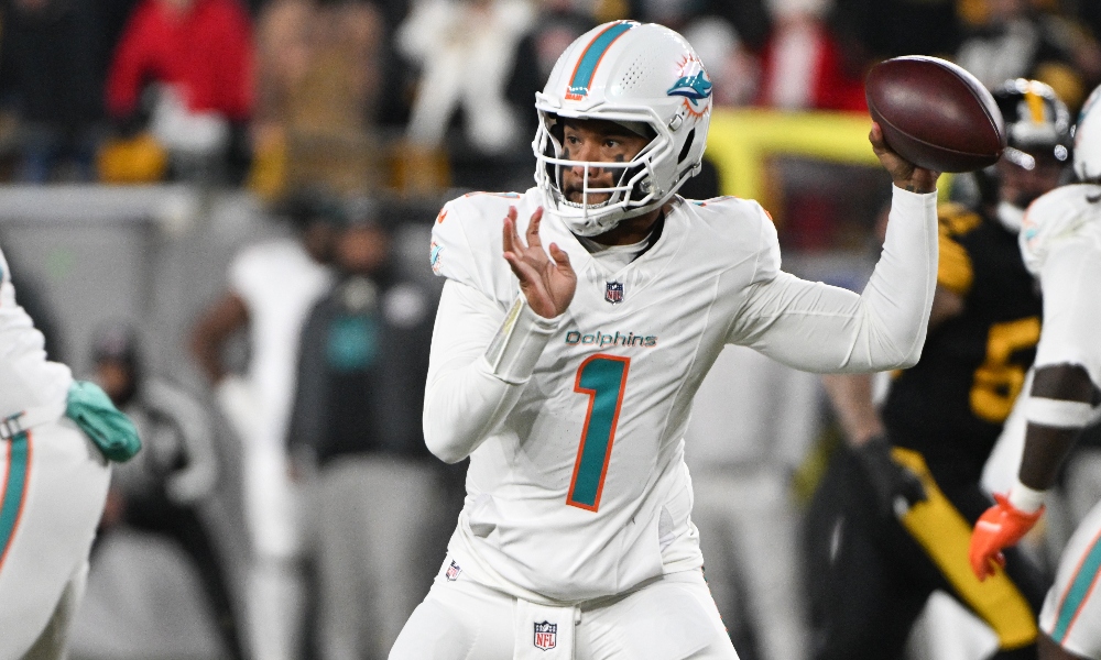 Dec 15, 2025; Pittsburgh, Pennsylvania, USA; Miami Dolphins quarterback Tua Tagovailoa (1) throws in the first quarter against the Pittsburgh Steelers at Acrisure Stadium.