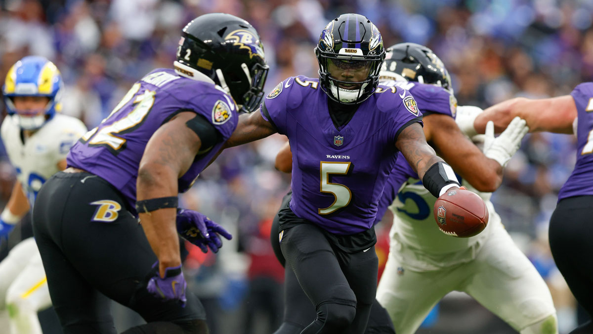 Baltimore Ravens quarterback Tyler Huntley (5) hand off the ball to running back Derrick Henry (22) against the Los Angeles Rams during the fourth quarter of the game at M&T Bank Stadium.