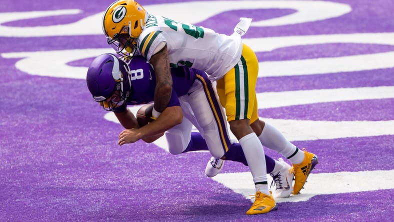 Jaire Alexander sacks Kirk Cousins in the end zone for a safety at U.S. Bank Stadium
