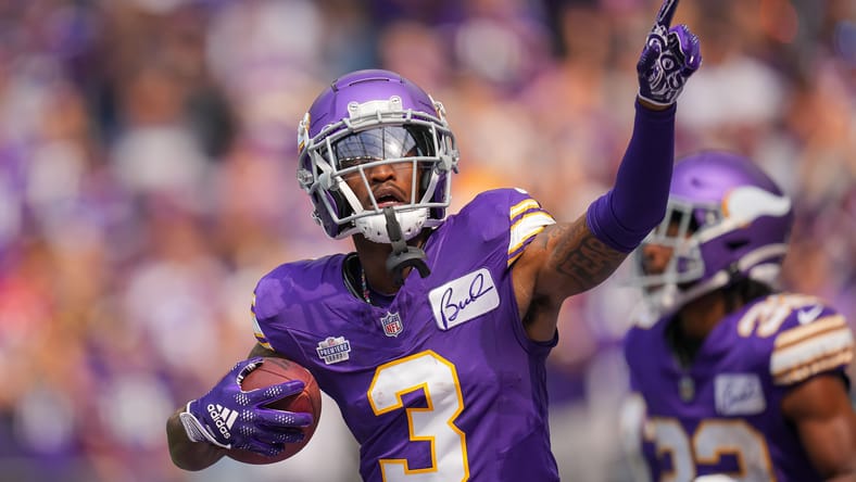 Jordan Addison celebrates his first NFL touchdown at U.S. Bank Stadium against the Buccaneers.