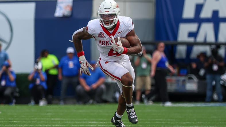 Mike Washington Jr. runs with the ball against Memphis. Vikings running back