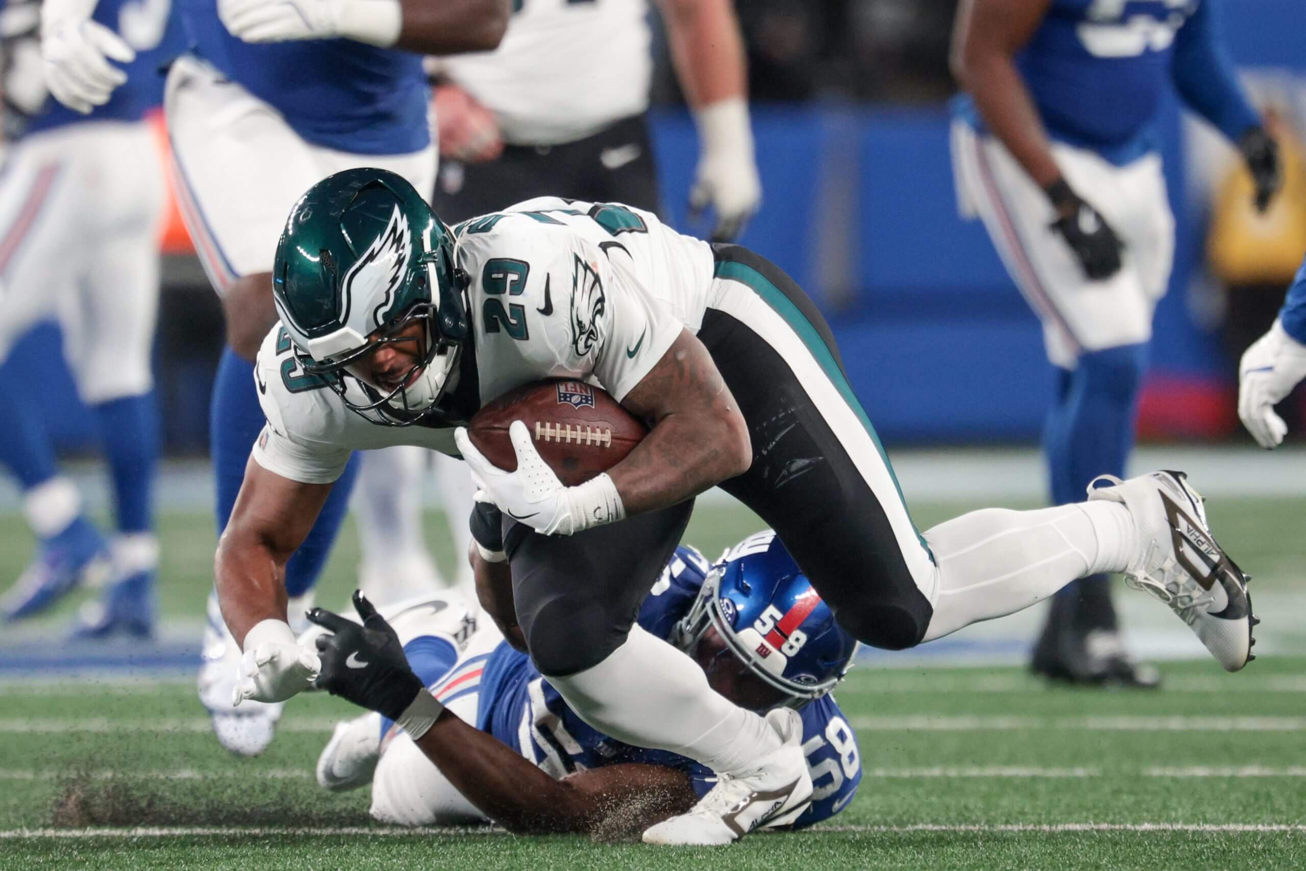 Philadelphia Eagles running back AJ Dillon (29) avoids a tackle by New York Giants linebacker Bobby Okereke (58) during the fourth quarter of the game at MetLife Stadium.