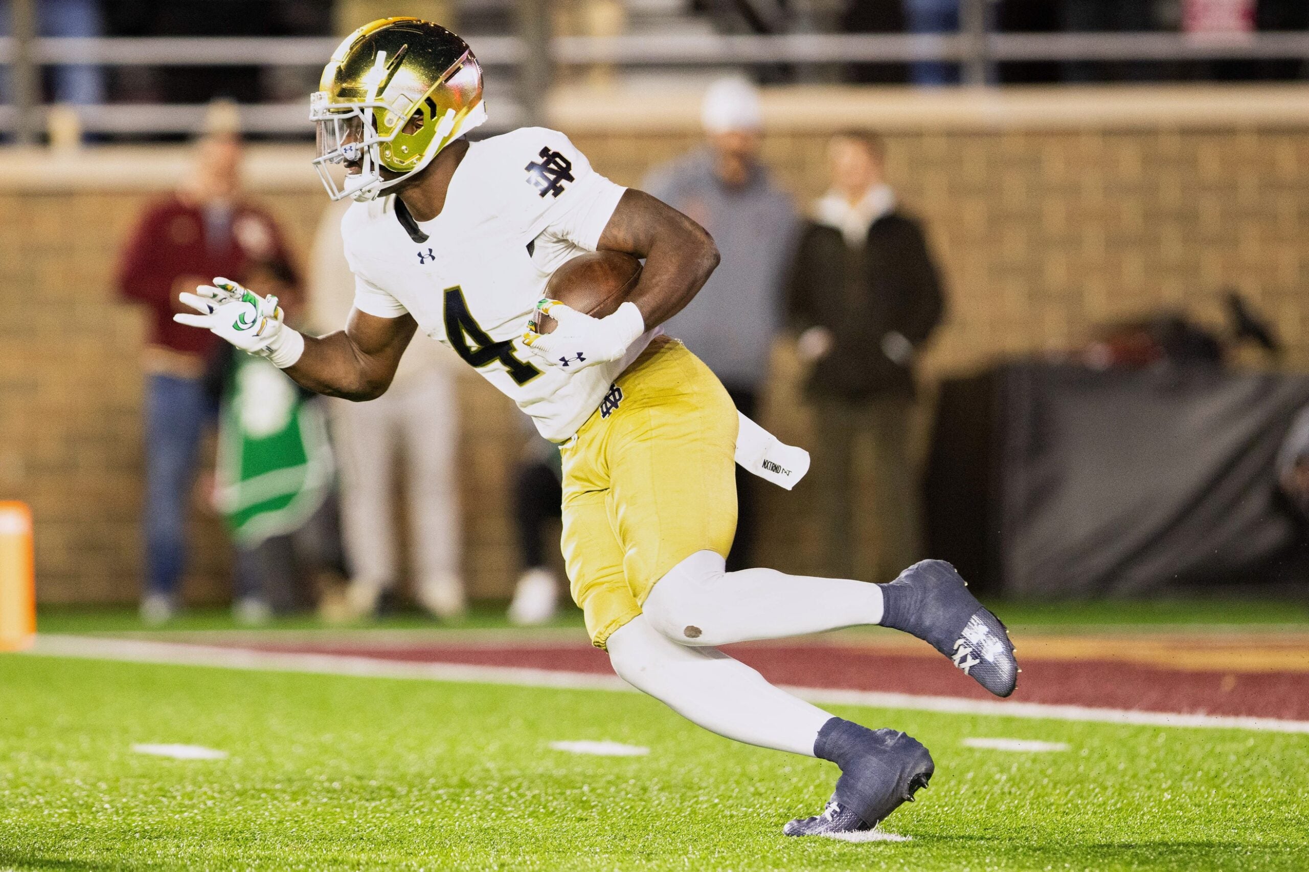 Nov 1, 2025; Chestnut Hill, Massachusetts, USA; Notre Dame Fighting Irish running back Jeremiyah Love (4) runs with the ball to score a 94 yard touchdown in the fourth quarter against the Boston College Eagles at Alumni Stadium. Mandatory Credit: Edward Finan-Imagn Images