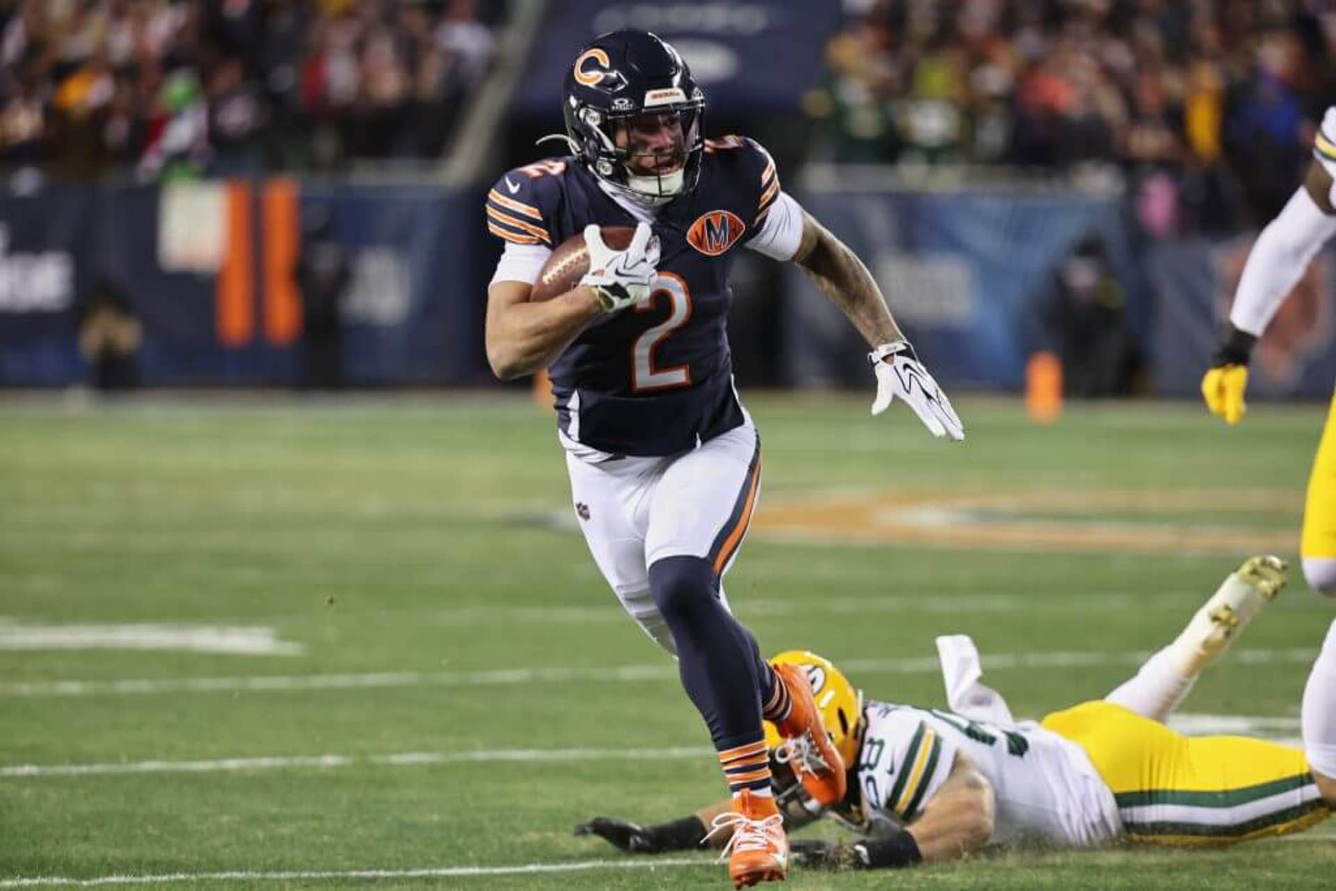 Chicago Bears wide receiver DJ Moore runs after the catch against Green Bay Packers guard Lecitus Smith during the first quarter at Soldier Field.