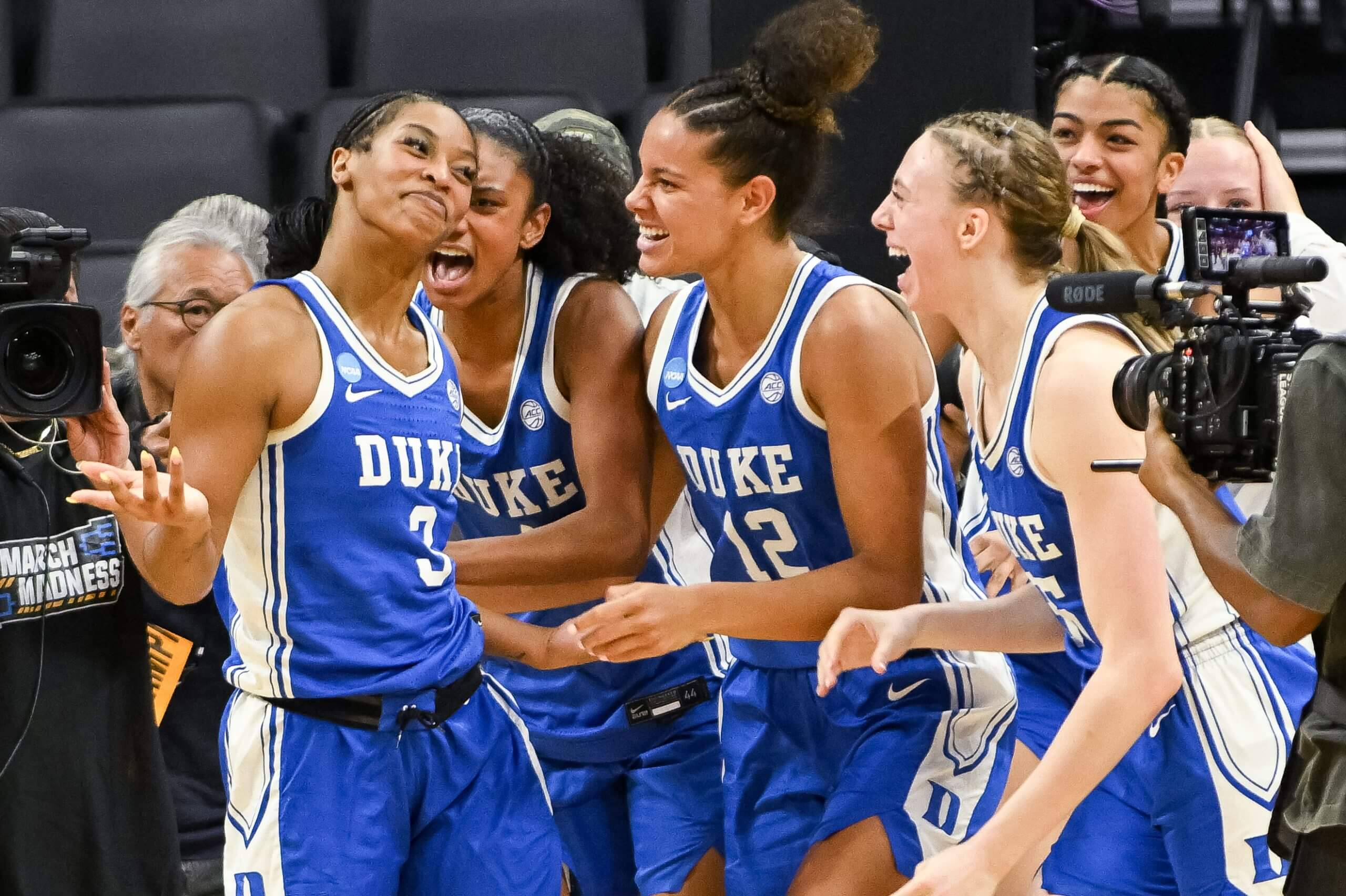 Duke's Ashlon Jackson (3) celebrates with Delaney Thomas (12) and Toby Fournier (35) after making the winning shot against LSU in their Sweet Sixteen thriller in Sacramento. (Ed Szczepanski / Imagn Images)