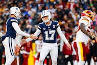 Dallas Cowboys place kicker Brandon Aubrey (17) celebrates with punter Bryan Anger (5) after...