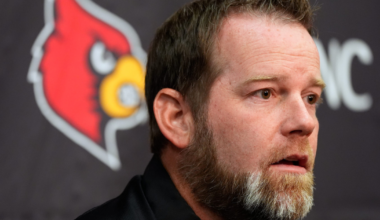 Louisville’s Lincoln Kienholz hands the ball off to Lekhy Thompkins in football practice at the Trager Center. March 17, 2026