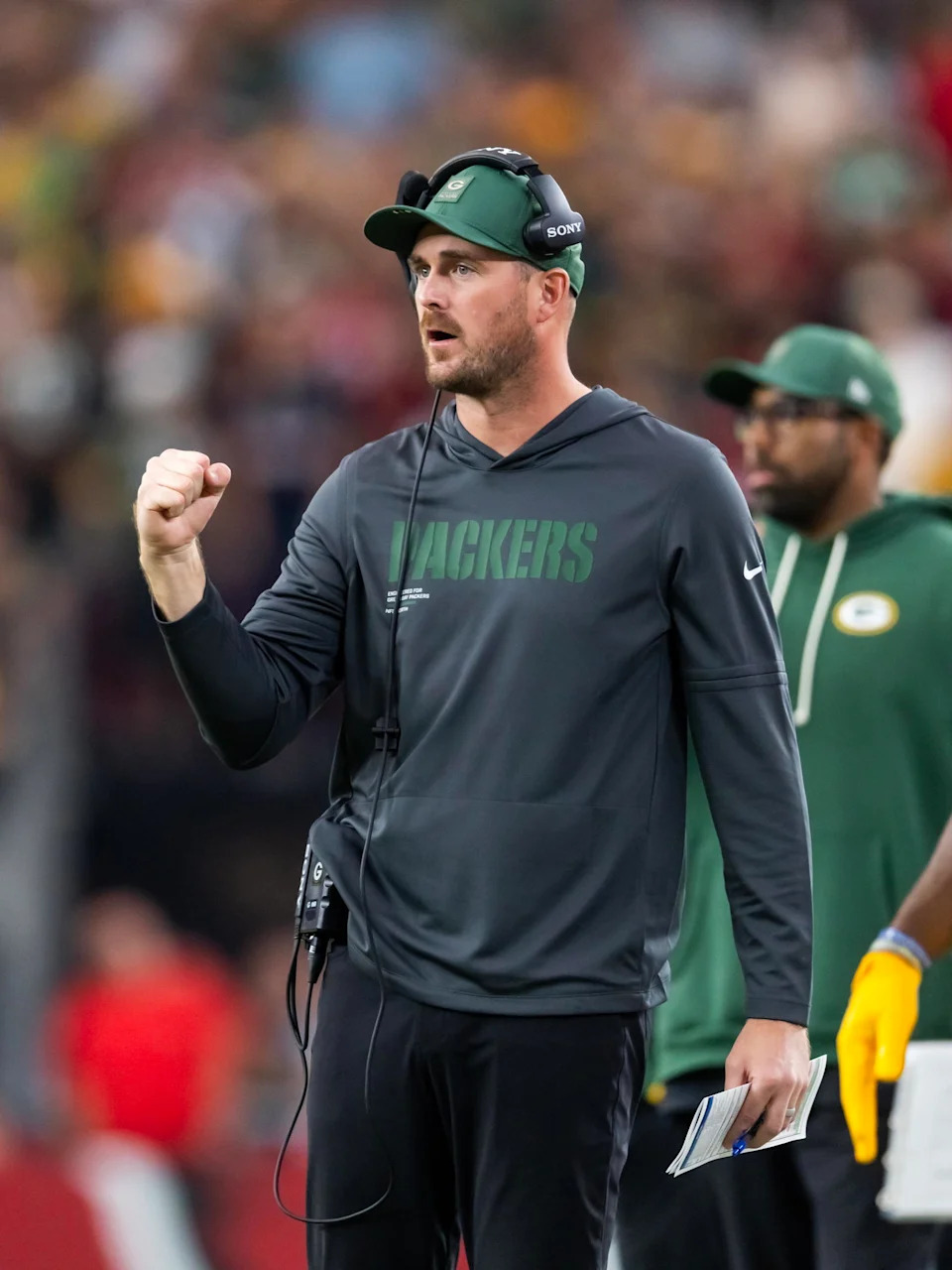 Oct 19, 2025; Glendale, Arizona, USA; Green Bay Packers quarterbacks coach Sean Mannion against the Arizona Cardinals at State Farm Stadium. Mandatory Credit: Mark J. Rebilas-Imagn Images