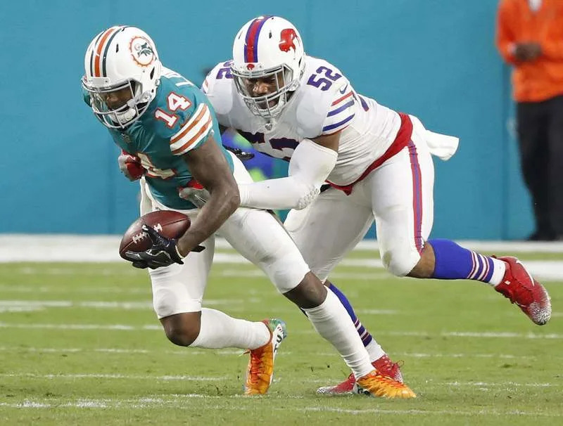 Buffalo at Miami Miami Dolphins wide receiver Jarvis Landry 14 is taken down by Buffalo Bills middle linebacker Preston Brown 52 in the second quarter at the Hard Rock Stadium in Miami Gardens, Fla., on Sunday, Dec. 31, 2017. The Bills won, 22-16. Al Diaz/Miami Herald/TNS Miami Gardens FL USA EDITORIAL USE ONLY Copyright: xx 1219892 ALxDIAZx krtphotoslive813916