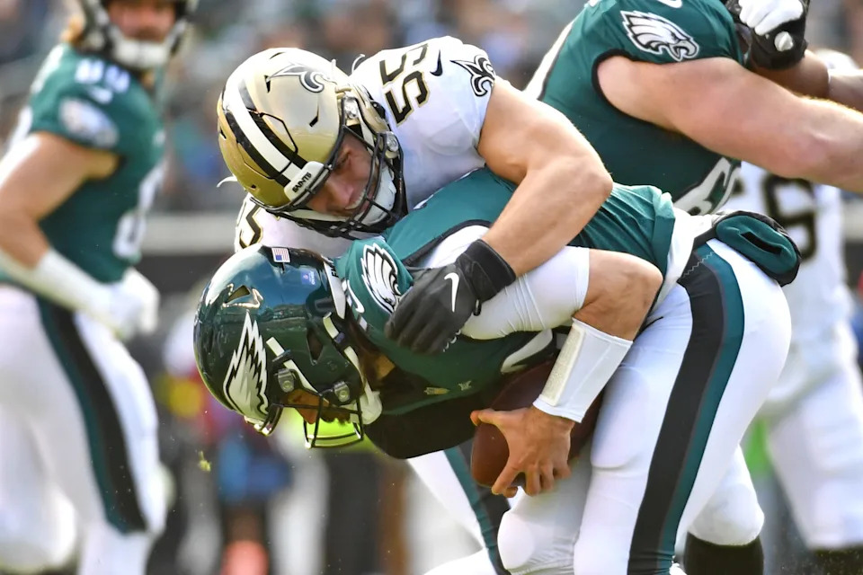 Jan 1, 2023; Philadelphia, Pennsylvania, USA; Philadelphia Eagles quarterback Gardner Minshew (10) is sacked by New Orleans Saints linebacker Kaden Elliss (55) during the first quarter at Lincoln Financial Field. Mandatory Credit: Eric Hartline-USA TODAY Sports