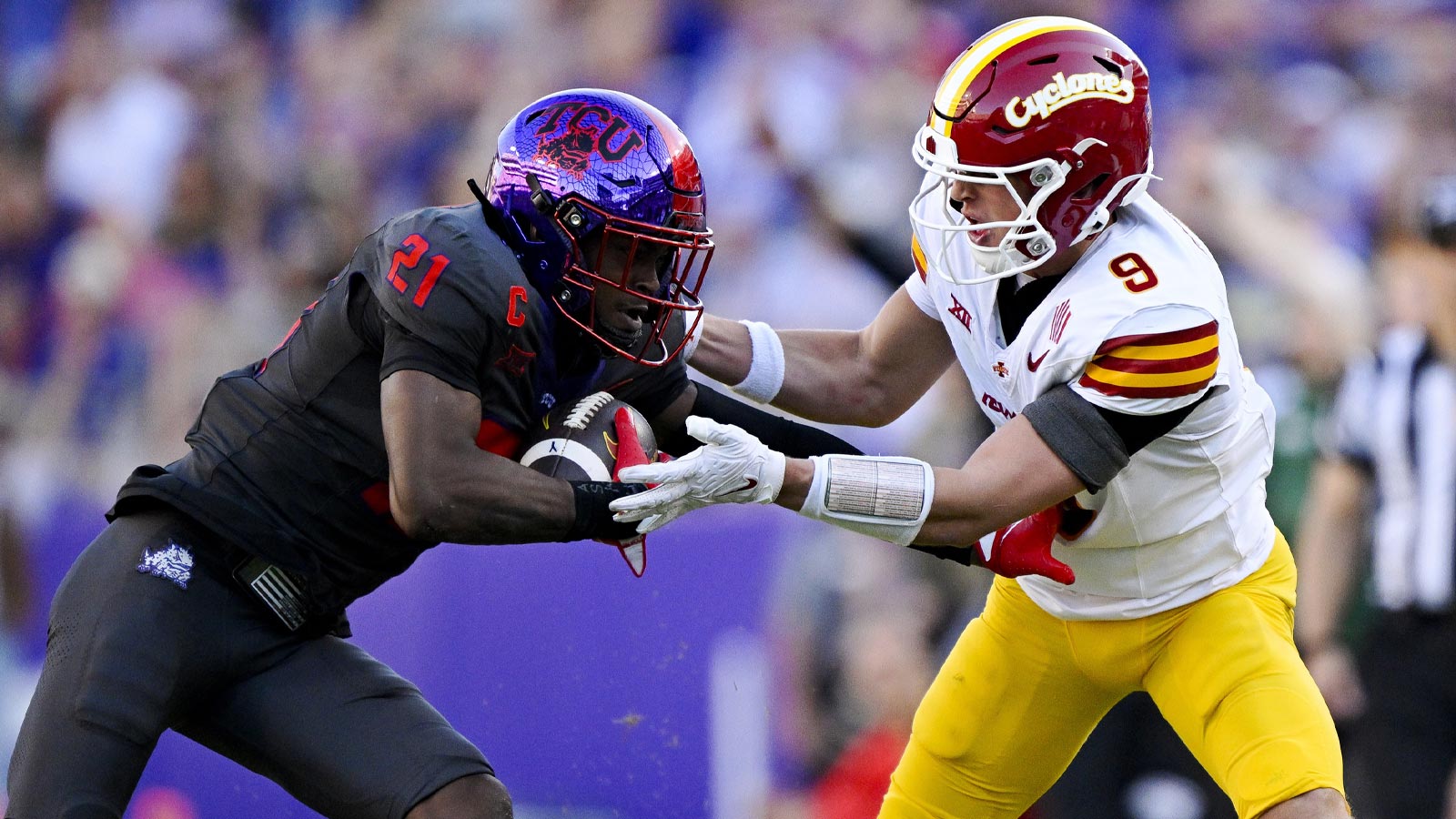 TCU Horned Frogs safety Bud Clark (21) intercepts a pass intended for Iowa State Cyclones wide receiver Brett Eskildsen (9) during the first half at Amon G. Carter Stadium. 