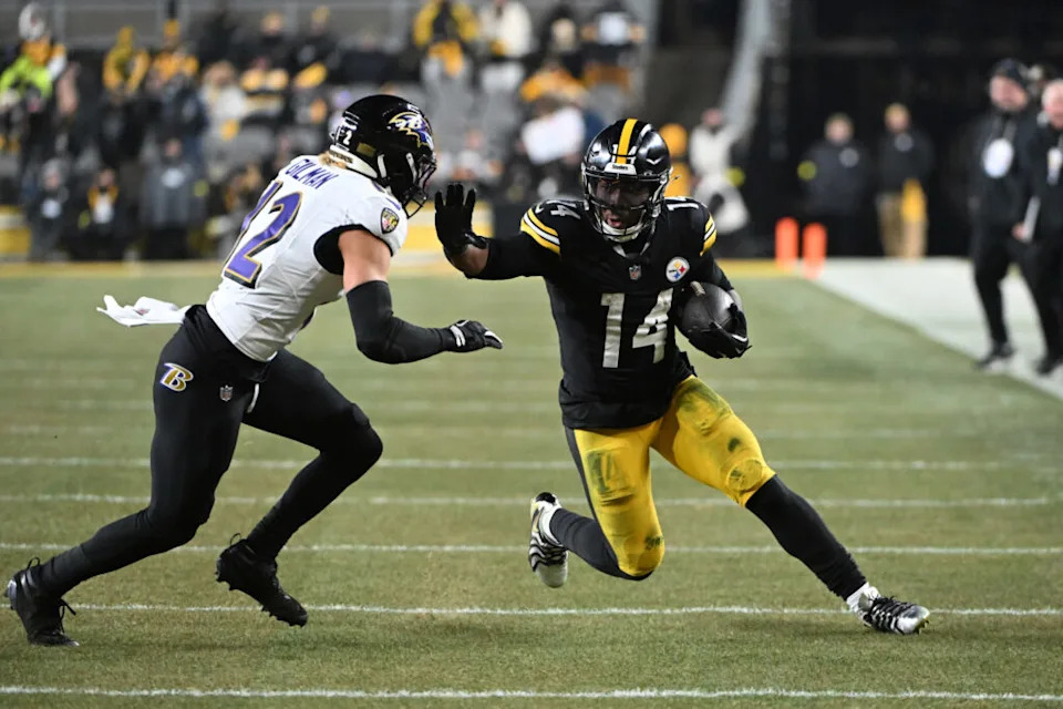 Jan 4, 2026; Pittsburgh, Pennsylvania, USA; Pittsburgh Steelers running back Kenneth Gainwell (14) rushes the ball against Baltimore Ravens safety Alohi Gilman (12) during the first half at Acrisure Stadium. Mandatory Credit: Barry Reeger-Imagn Images