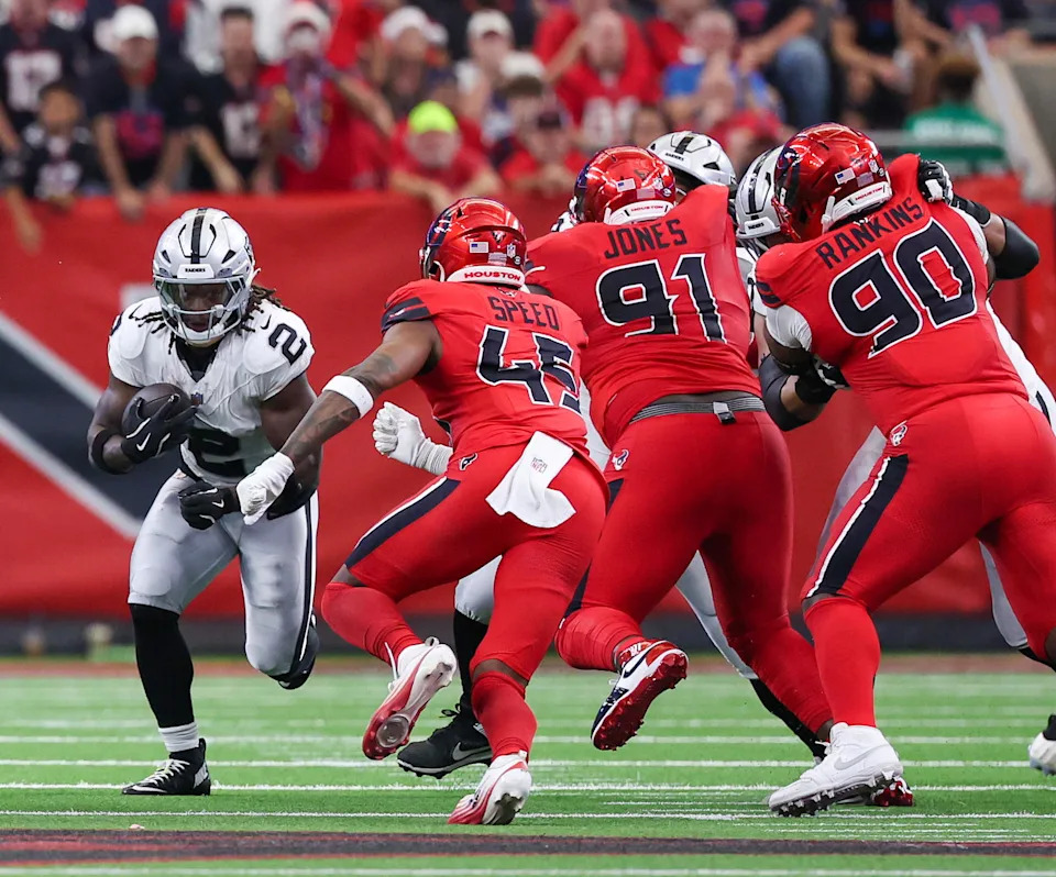 Las Vegas Raiders running back Ashton Jeanty (2) rushes against the Houston Texans linebacker E.J. Speed (45) in the first quarter at NRG Stadium. Thomas Shea-Imagn Images