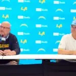 Los Angeles Chargers general manager Joe Hortiz (left) and coach Jim Harbaugh at press conference at The Bolt.